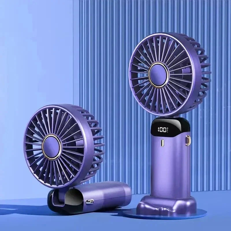 Two purple portable handheld fans with circular grates and digital temperature displays, shown on a blue studio background with vertical stripe texture.